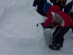 Snow Construction Children building snow fort